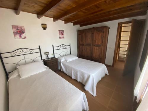 A bed or beds in a room at Pajero Las Cadenas