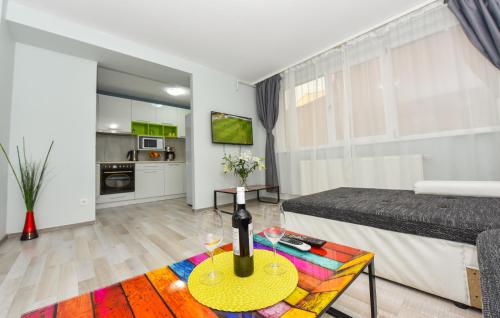 a living room with a bed and a table at Royal Accommodation in Bucharest