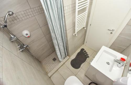 an overhead view of a bathroom with a toilet and a sink at Royal Accommodation in Bucharest