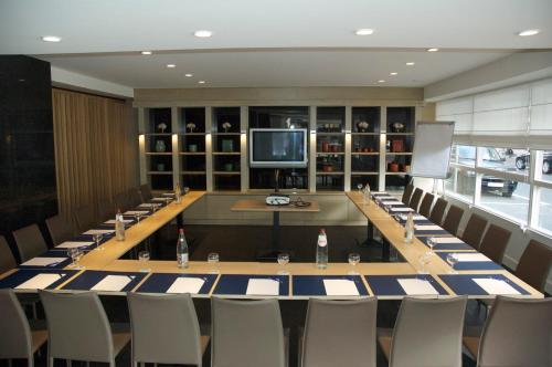 a large conference room with a long table and chairs at Hotel Nelson in Knokke-Heist