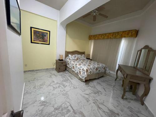 Postel nebo postele na pokoji v ubytování Costa Bonita Condominiums & Beach Resort - Primer planta