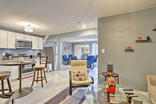 a living room with a kitchen and a dining room at 32 Mi to DC Lower-Level Woodbridge Apt with Patio! in Woodbridge