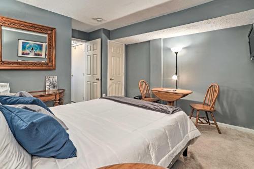 a bedroom with a bed and a table and chairs at 32 Mi to DC Lower-Level Woodbridge Apt with Patio! in Woodbridge