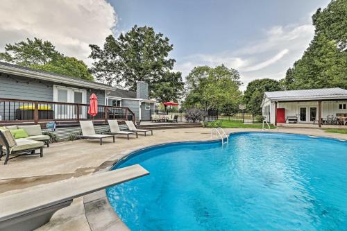a swimming pool with chairs and a house at Quiet Nashville Area Home with Pool - 15 Mi to Dtwn in Joelton