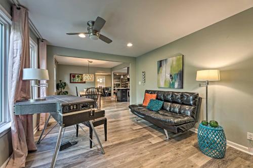 a living room with a couch and a table at Quiet Nashville Area Home with Pool - 15 Mi to Dtwn in Joelton
