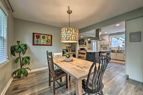 a kitchen and dining room with a wooden table and chairs at Quiet Nashville Area Home with Pool - 15 Mi to Dtwn in Joelton