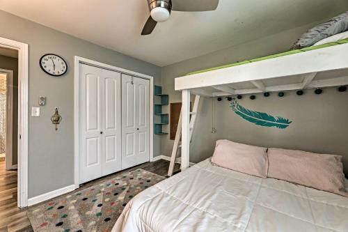 a bedroom with a bunk bed and a clock at Quiet Nashville Area Home with Pool - 15 Mi to Dtwn in Joelton