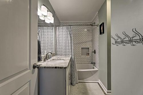 a bathroom with a sink and a bath tub at Quiet Nashville Area Home with Pool - 15 Mi to Dtwn in Joelton