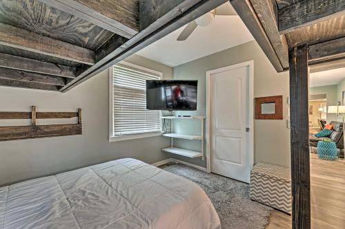 a bedroom with a bed and a flat screen tv at Quiet Nashville Area Home with Pool - 15 Mi to Dtwn in Joelton