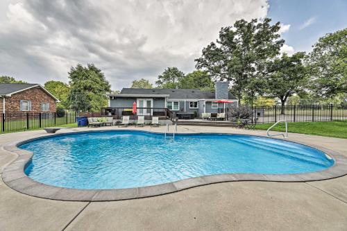 a swimming pool in front of a house at Quiet Nashville Area Home with Pool - 15 Mi to Dtwn in Joelton