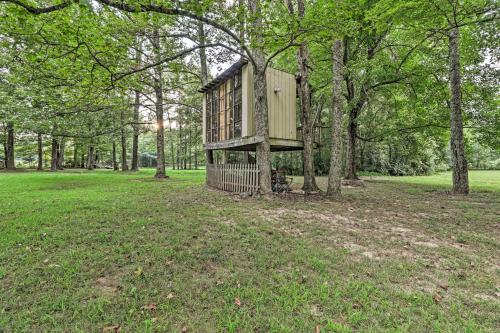 a tree house in the middle of a field at Quiet Nashville Area Home with Pool - 15 Mi to Dtwn in Joelton