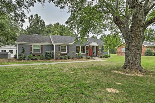 a house with a tree in the yard at Quiet Nashville Area Home with Pool - 15 Mi to Dtwn in Joelton