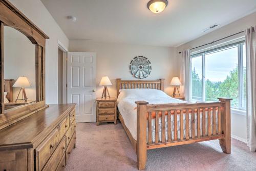 a bedroom with a bed and a large window at Charming Redmond Townhome with Resort Amenities in Redmond