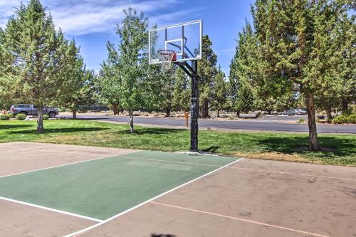 a basketball hoop in a park with trees at Charming Redmond Townhome with Resort Amenities in Redmond