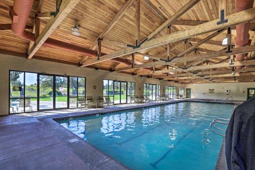 a large swimming pool with a wooden ceiling at Charming Redmond Townhome with Resort Amenities in Redmond