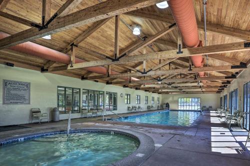 an indoor swimming pool with a wooden ceiling at Charming Redmond Townhome with Resort Amenities in Redmond