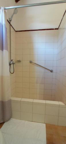 a bathroom with a shower with a tub at Pino Dorado in Punta del Este