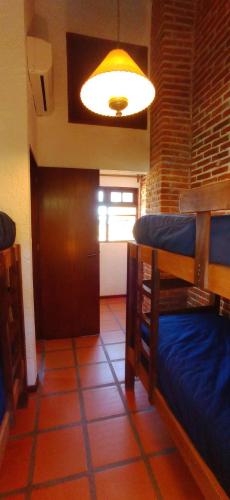 a room with two bunk beds and a light at Pino Dorado in Punta del Este