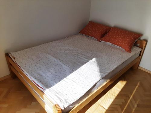 a bed with two pillows on it in a room at IV2020 apartment in Skopje