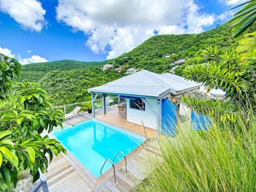 an image of a house with a swimming pool at Aquamarine, private room in Villa Casa Blue pool sea view in Koolbaai