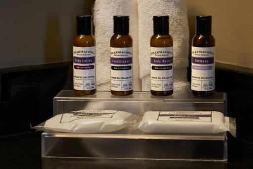 a group of four bottles of alcohol sitting on a counter at Hyatt Regency Lisle near Naperville in Lisle
