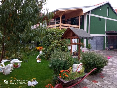 a backyard with a garden with a gazebo at Guest House Vila Banjica in Pirot