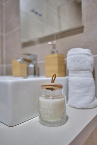 a jar of mayonnaise on a counter in a bathroom at L&N Apartmani Kopaonik-Milmari Resort in Kopaonik