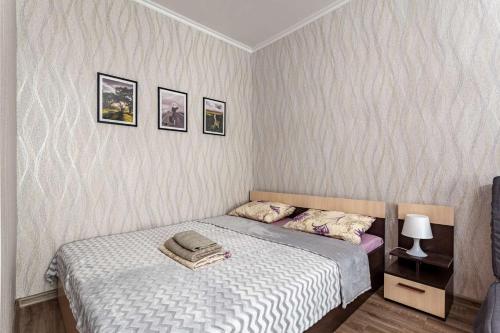  Кровать или кровати в номере Economy Brusnika Apartments Maryino 