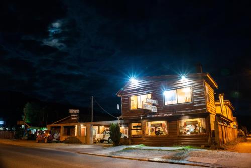 a building with lights on top of it at night at Entre Montañas in Hornopiren