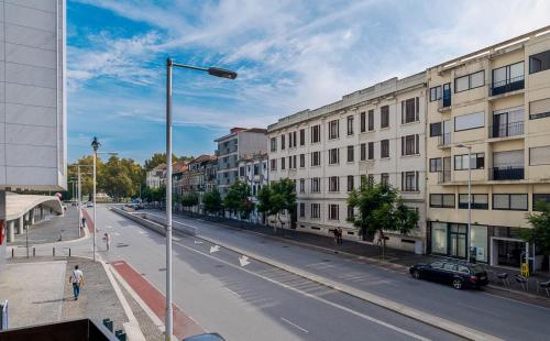a city street with a street light and buildings at Avenue View Rooms in Porto