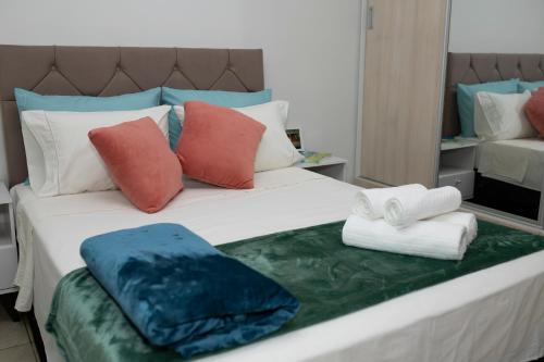 מיטה או מיטות בחדר ב-Espaço da Mélia