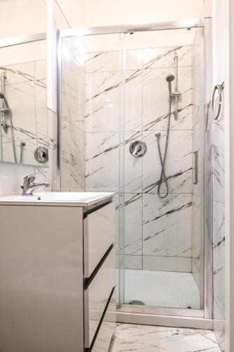 a bathroom with a shower and a sink at Casa Bellemo in Chioggia