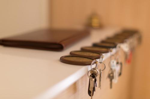 a row of keys sitting on a stove top at Ristorante Hotel Lucia - 100 mt dal mare in Giulianova