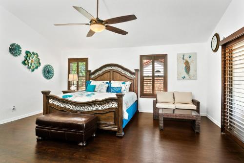 a bedroom with a bed and a ceiling fan at Aspen Adventure in Avondale