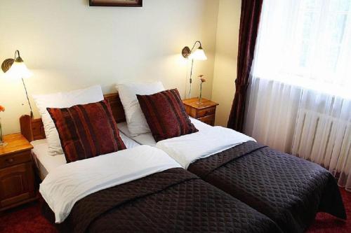 Katil atau katil-katil dalam bilik di Hotel Przy Oślej Bramie - Zamek Książ