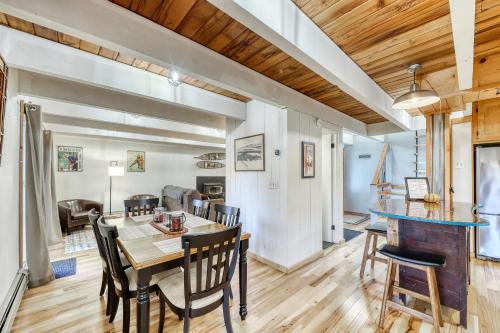 a dining room and living room with a table and chairs at Jay Chalet in Jay