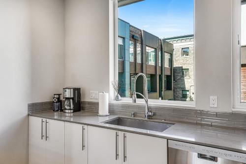 a kitchen with a sink and a window at Capitol Hill Vista in Seattle