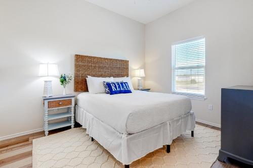 a bedroom with a large bed and a window at Sunrise Retreat in Rockport
