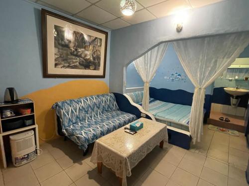 Postel nebo postele na pokoji v ubytování Wangyuku B&B