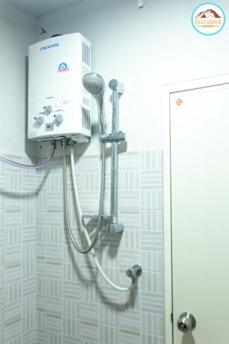 a shower in a bathroom with aperature at Phurubmok khaokho in Khao Kho