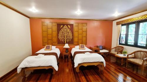 Ένα ή περισσότερα κρεβάτια σε δωμάτιο στο Hotel Siblanburi Resort
