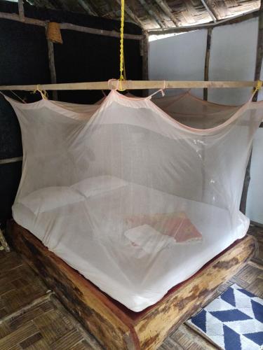 a hammock that is wrapped in plastic at Emerald Gecko in Havelock Island
