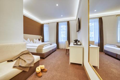 Postel nebo postele na pokoji v ubytování Villa Tell rooms and suites
