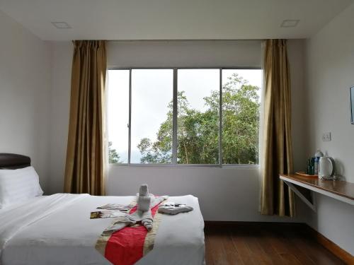 Tempat tidur dalam kamar di Ayana Holiday Resort