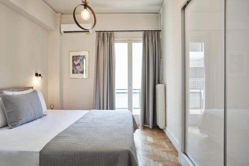 Postel nebo postele na pokoji v ubytování Ilisia Park Contemporary 2BD Condo