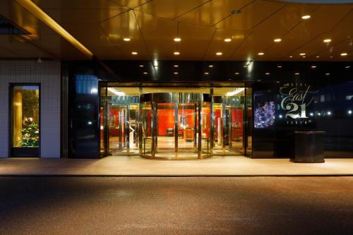 a store front with a revolving door in a building at Hotel East 21 Tokyo in Tokyo