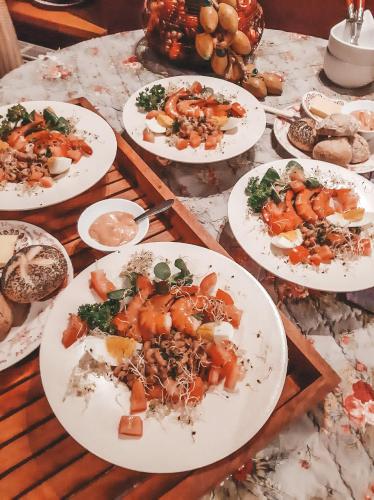 a bunch of plates of food on a table at Hoeve Westdijk in Oostkamp