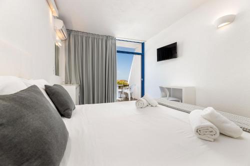 Postel nebo postele na pokoji v ubytování Hippocampus Hotel