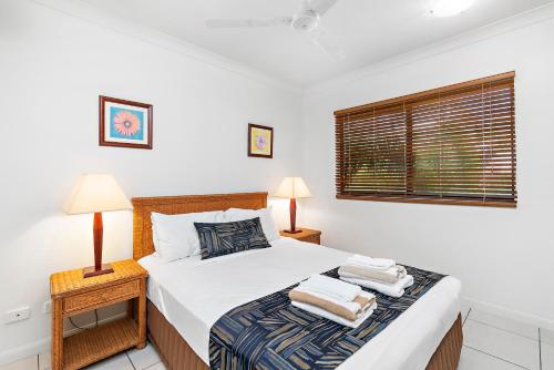 Ένα ή περισσότερα κρεβάτια σε δωμάτιο στο Meridien Beachfront Apartments at Trinity Beach