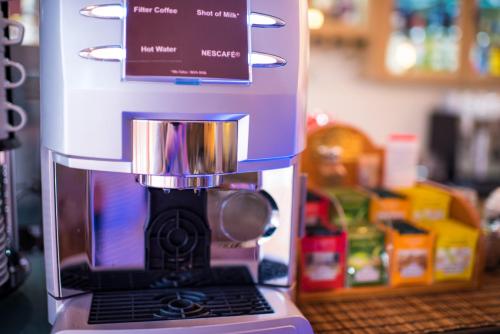 a coffee maker sitting on top of a counter at Anastazia Luxury Suites & Spa in Athens